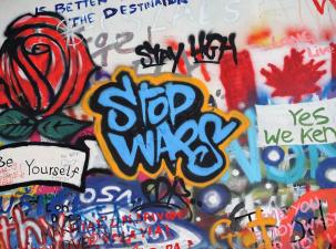 Colourful anti-war street art mural