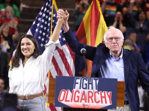 U.S. Congresswoman Alexandria Ocasio-Cortez and U.S. Senator Bernie Sanders speaking with attendees at a "Fight Oligarchy" rally at Mullett Arena in Tempe, Arizona.