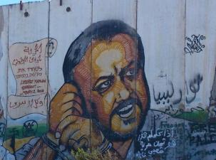 Mural of Palestinian rights activist and political figure Marwan Barghouti. It is painted on the Israeli separation wall in Kalandia, the crossing point between Jerusalem and Ramallah.