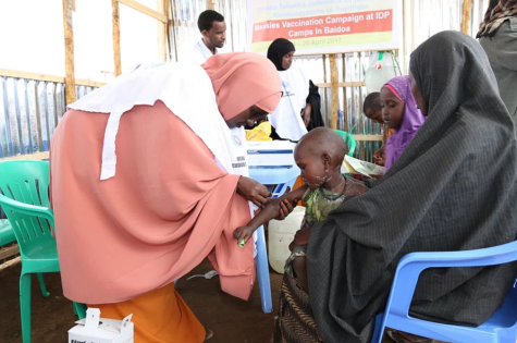 A child receives a measles vaccine at the launch of a UNICEF-supported immunization campaign 