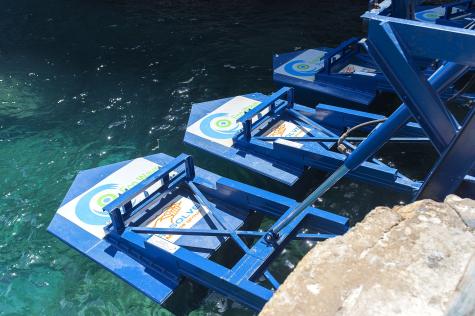 A few of the blue wave energy floaters at the Gibraltar Wave Farm.