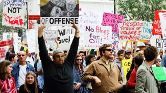 March Against Iraq War in Los Angeles, many people holder anti-war posters 