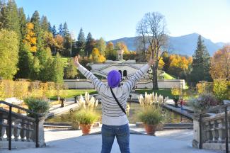 A Happy girl during her vacation time in Germany at the beautiful castle garden